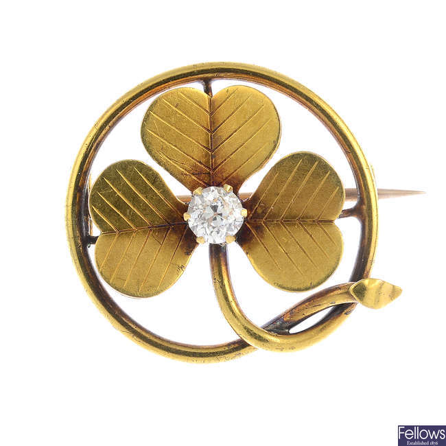An early 20th century gold diamond brooch.