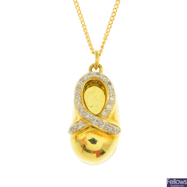 An 18ct gold diamond shoe pendant, with 18ct gold chain.