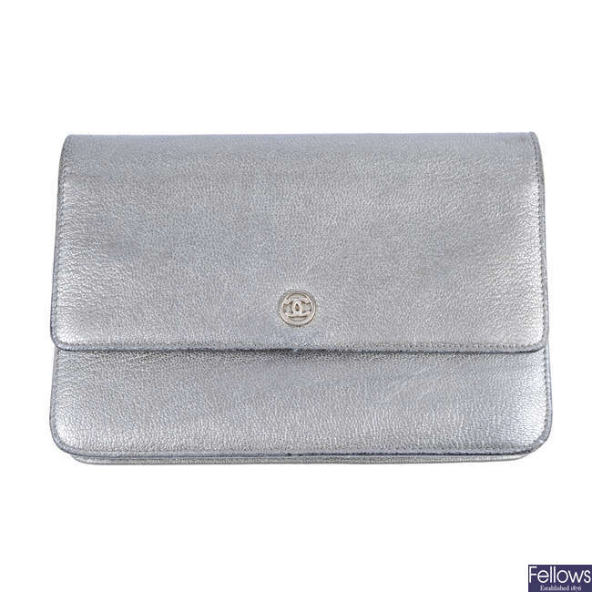 CHANEL - a silver leather WOC handbag.