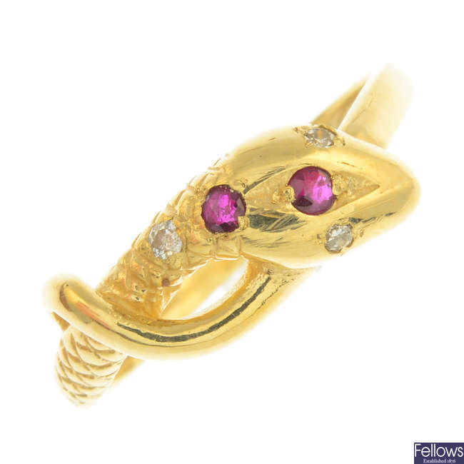 A 9ct gold ruby and diamond snake ring and a pair of ruby earrings.