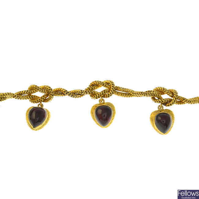 A mid Victorian gold foil-back garnet bracelet.