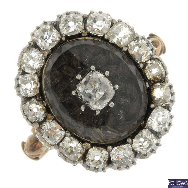 An early Victorian silver and gold diamond and rock crystal mourning ring.