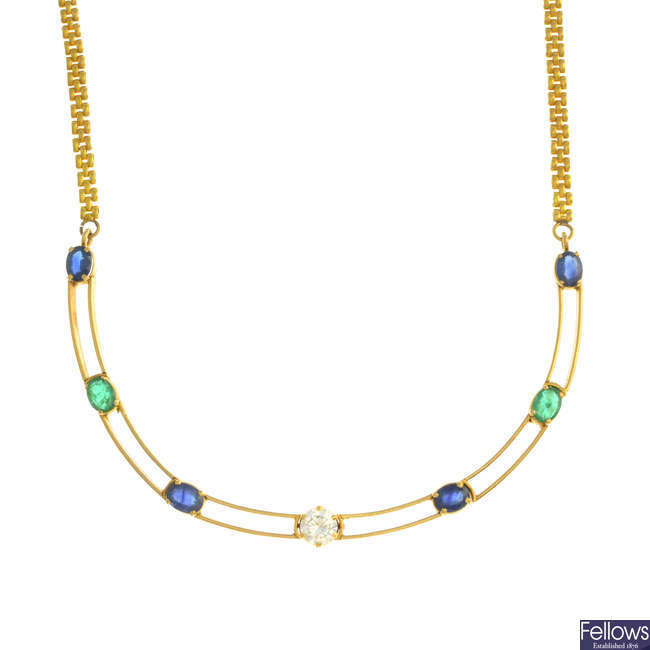 A diamond, sapphire and emerald necklace.