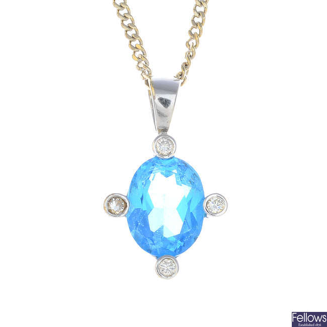 An 18ct gold topaz and diamond pendant, with chain.