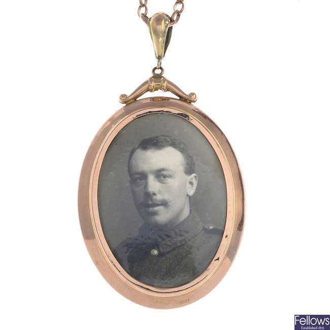 An early 20th century 9ct gold photograph pendant, with chain.