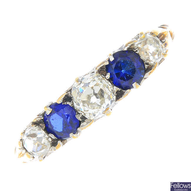 A diamond and sapphire five-stone ring.