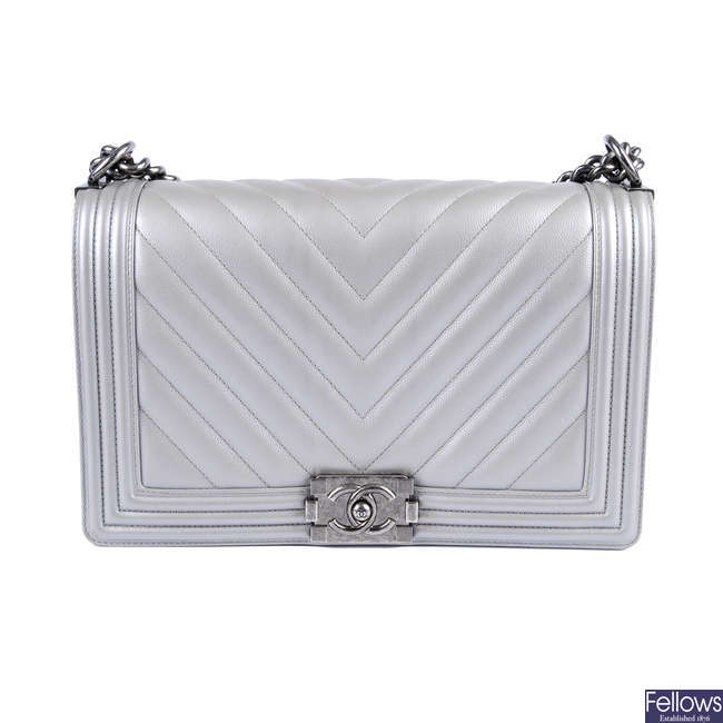 CHANEL - a chevron quilted silver leather Boy handbag.