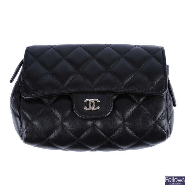 CHANEL - a black quilted make-up pouch.