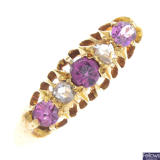 An early 20th century 18ct gold garnet and diamond five-stone ring.