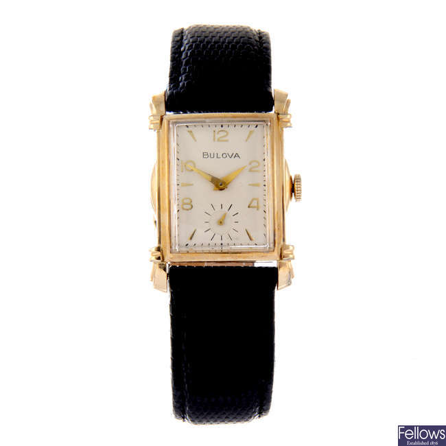 BULOVA - a gold plated wrist watch with a similar gold plated Bulova wrist watch.