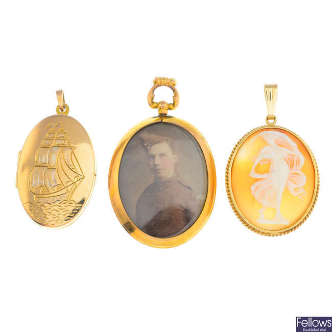 An early 20th century picture locket and two pendants
