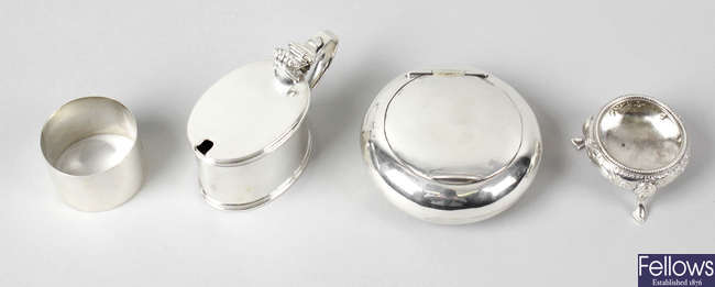 An Edwardian silver mustard pot & napkin ring, a Victorian silver open salt & a later silver tobacco box. (4).