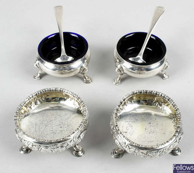 A pair of George II silver open salts & a pair of George III silver embossed salts, plus two salt spoons. 