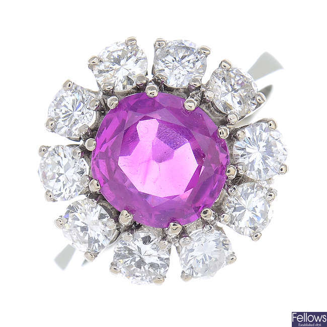A Burmese pink sapphire and diamond cluster ring.