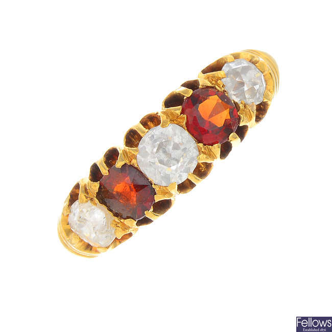 A late Victorian 18ct gold diamond and garnet five-stone ring.