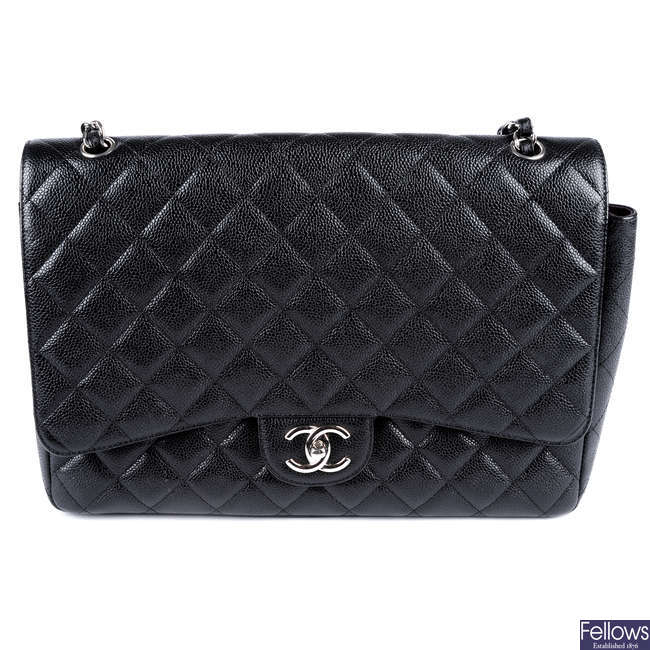 CHANEL - a Maxi Caviar Classic Double Flap handbag.