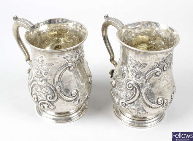 Two mid-Victorian silver embossed mugs.