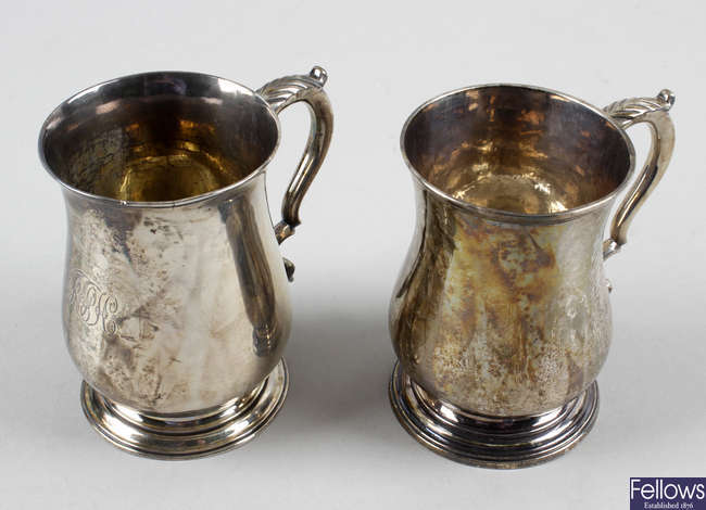 Two George III small silver baluster mugs, one monogrammed,
