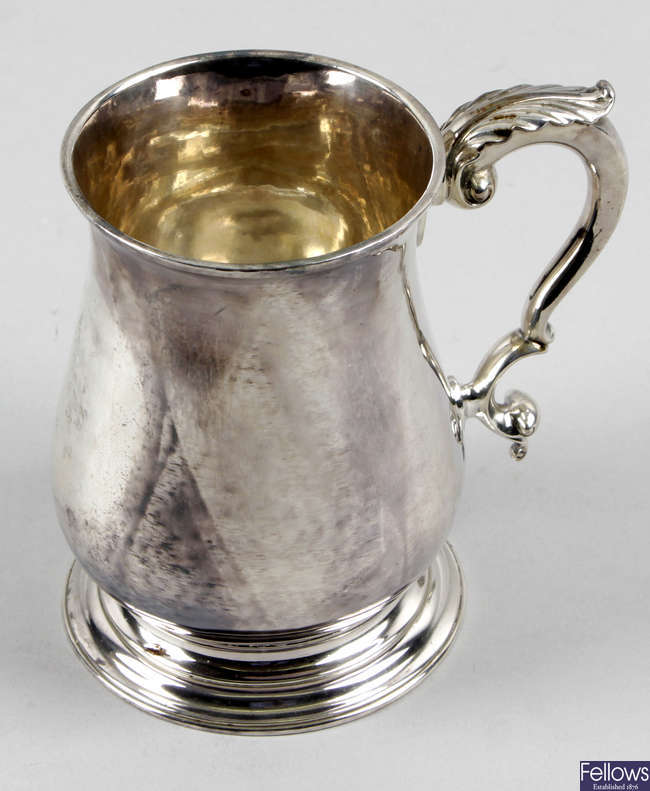 A George II silver baluster pint mug.