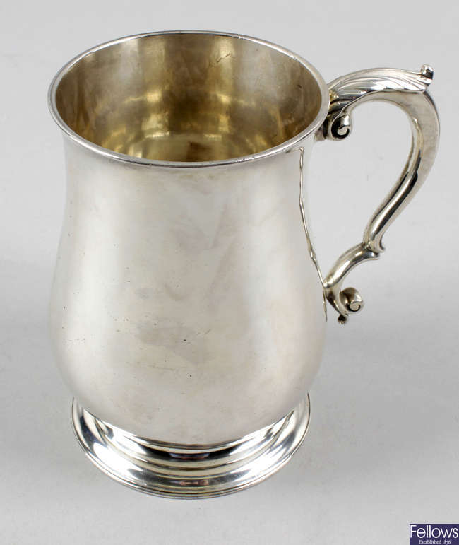A George II silver baluster pint mug.