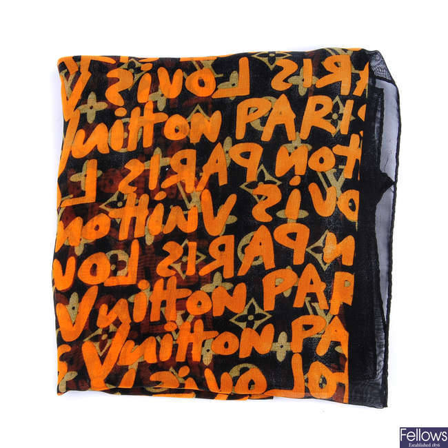 LOT:223  LOUIS VUITTON - a Graffiti Logo sheer scarf.