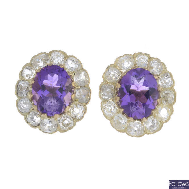 A pair of amethyst and diamond cluster earrings.