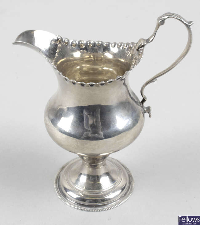 A George III silver cream jug by Hester Bateman.