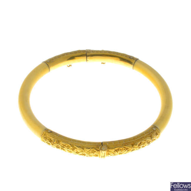 An early 20th century gold ivory bangle.