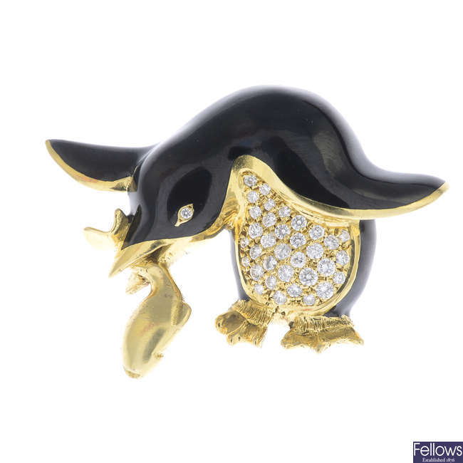 GARRARD & CO. - an 18ct gold diamond and enamel penguin brooch.