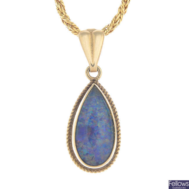 A 9ct gold opal triplet pendant with a 9ct  gold chain.