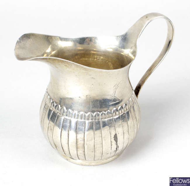 A George III Irish silver cream jug.
