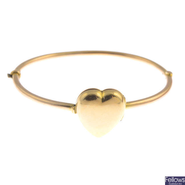 An early 20th century gold hinged bangle.