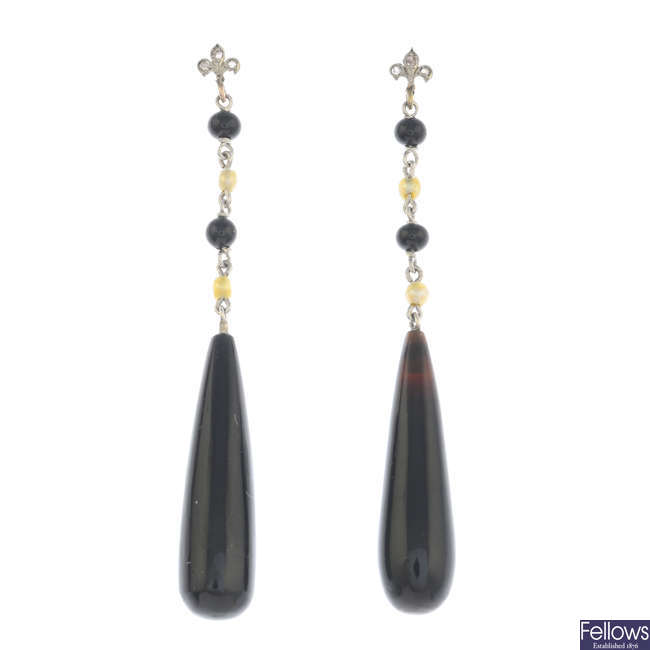 A pair of onyx, pearl and diamond drop earrings.