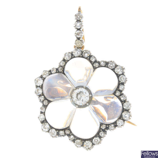 A late Victorian silver and gold, diamond and moonstone floral pendant.