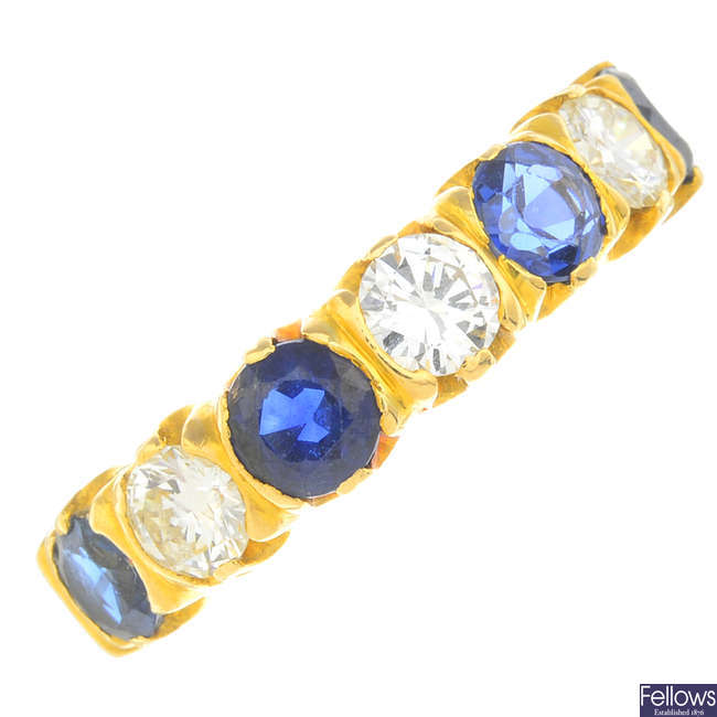 A sapphire and diamond seven-stone ring.