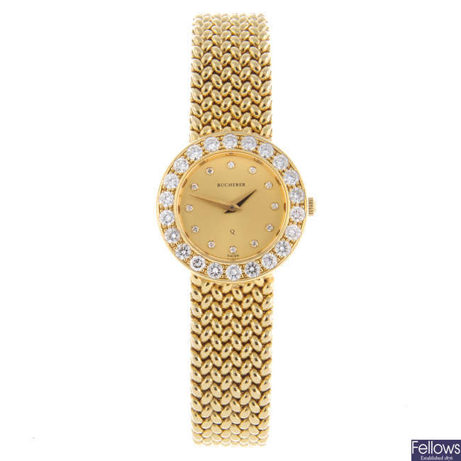 BUCHERER - a lady's yellow metal bracelet watch.