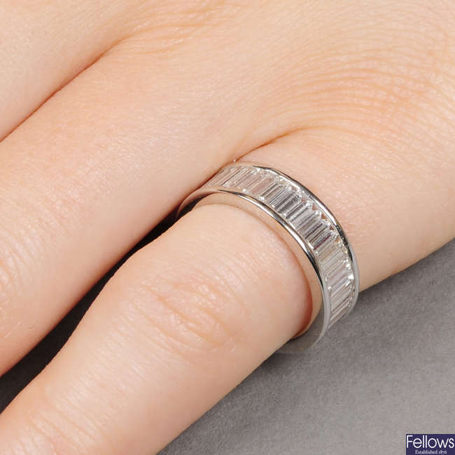 A baguette-cut diamond full eternity ring.