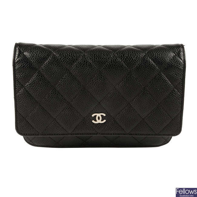 CHANEL - a black leather WOC handbag.