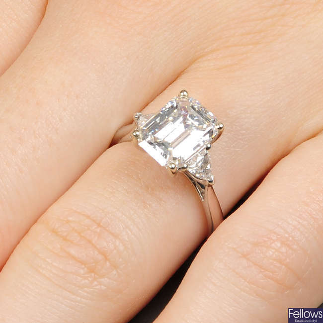 An 18ct gold rectangular-shape diamond single-stone ring, of 3.26cts, with triangular-shape diamond sides.
