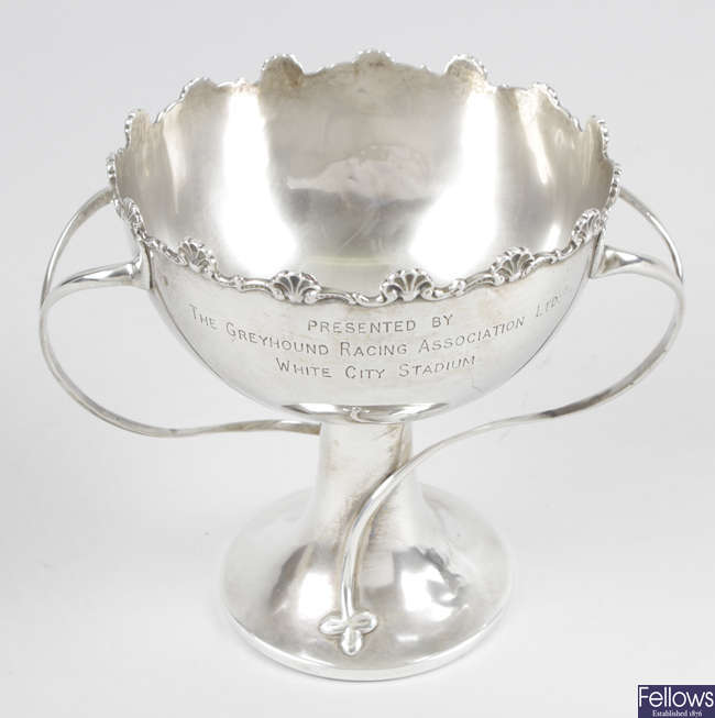 An Edwardian silver twin-handled pedestal bowl with shell and scroll rim.