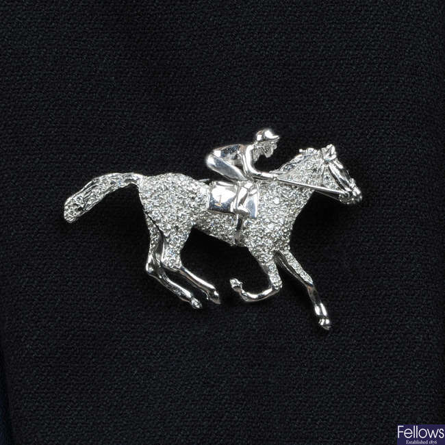A limited edition 18ct gold diamond horse and jockey brooch.