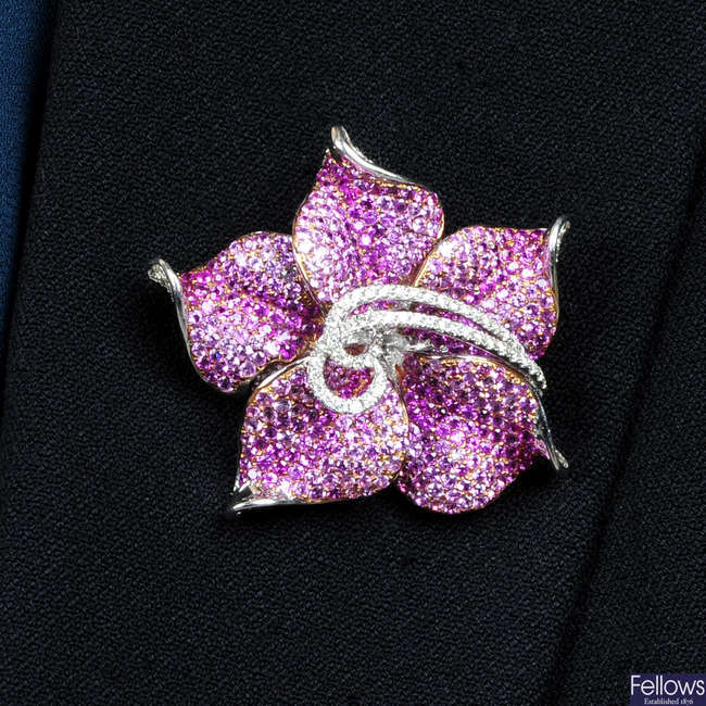 A diamond and pink sapphire flower brooch.