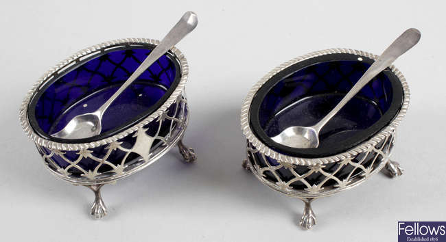 A pair of early George III silver pierced open salts, plus a pair of shovel condiment spoons.