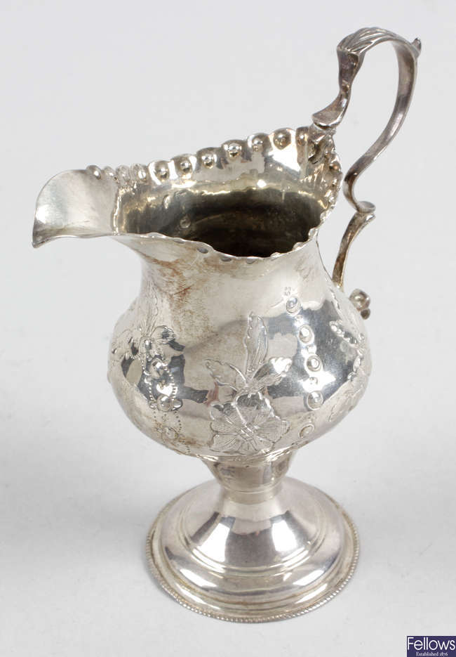 A George III silver pedestal cream jug, probably by Hester Bateman.