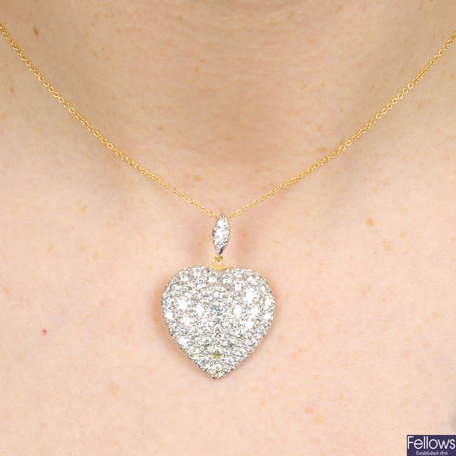 A pave-set diamond heart pendant, with chain.