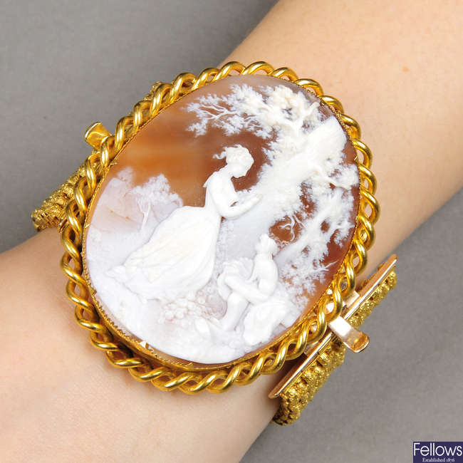 A 19th century gold shell cameo brooch, with detachable bracelet fitting.