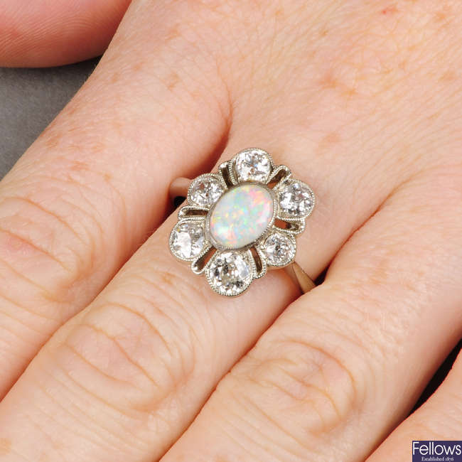 An early 20th century 18ct gold opal and old-cut diamond cluster ring.