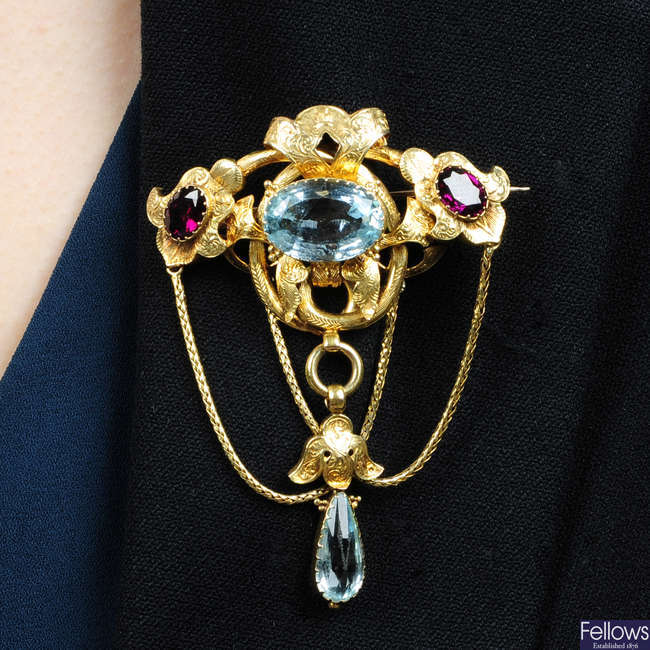 A mid 19th century 18ct gold aquamarine and garnet brooch.