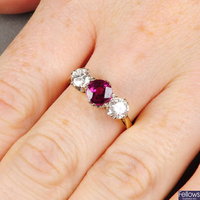 An 18ct gold Thai ruby and brilliant-cut diamond three-stone ring.