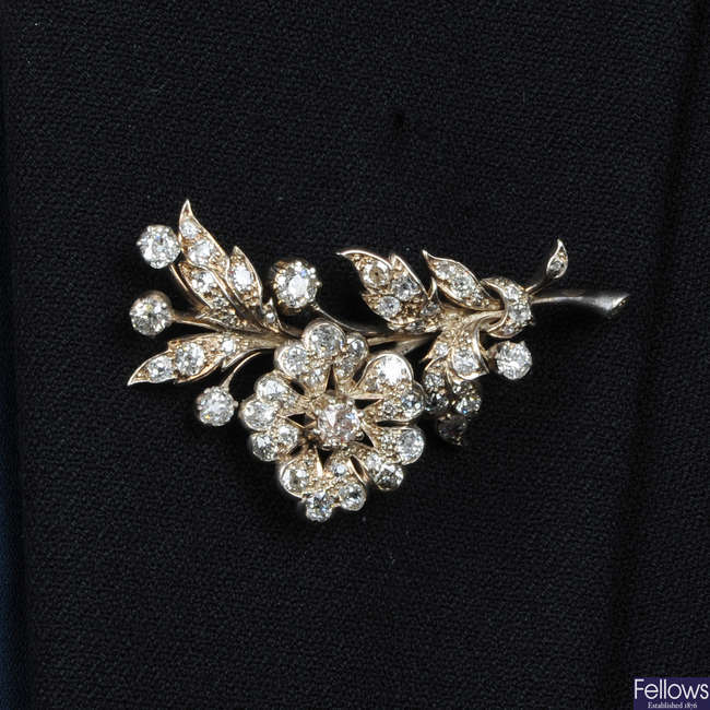 An early 20th century silver and gold old-cut diamond floral spray brooch.